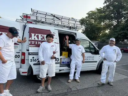 Walker Painting crew beside their company vans