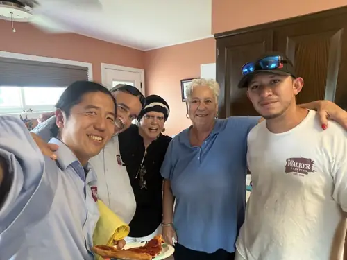 The Walker Painting crew with a longtime client